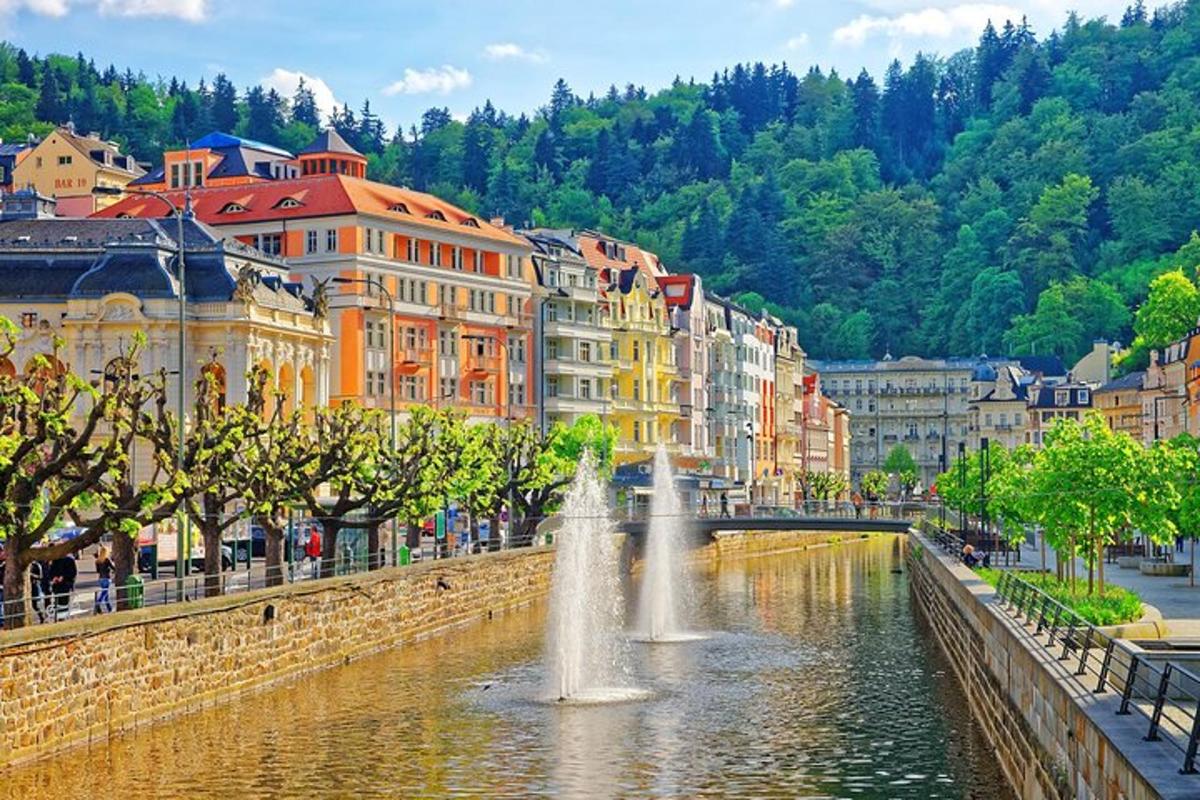 a city with a fountain in the middle of a river