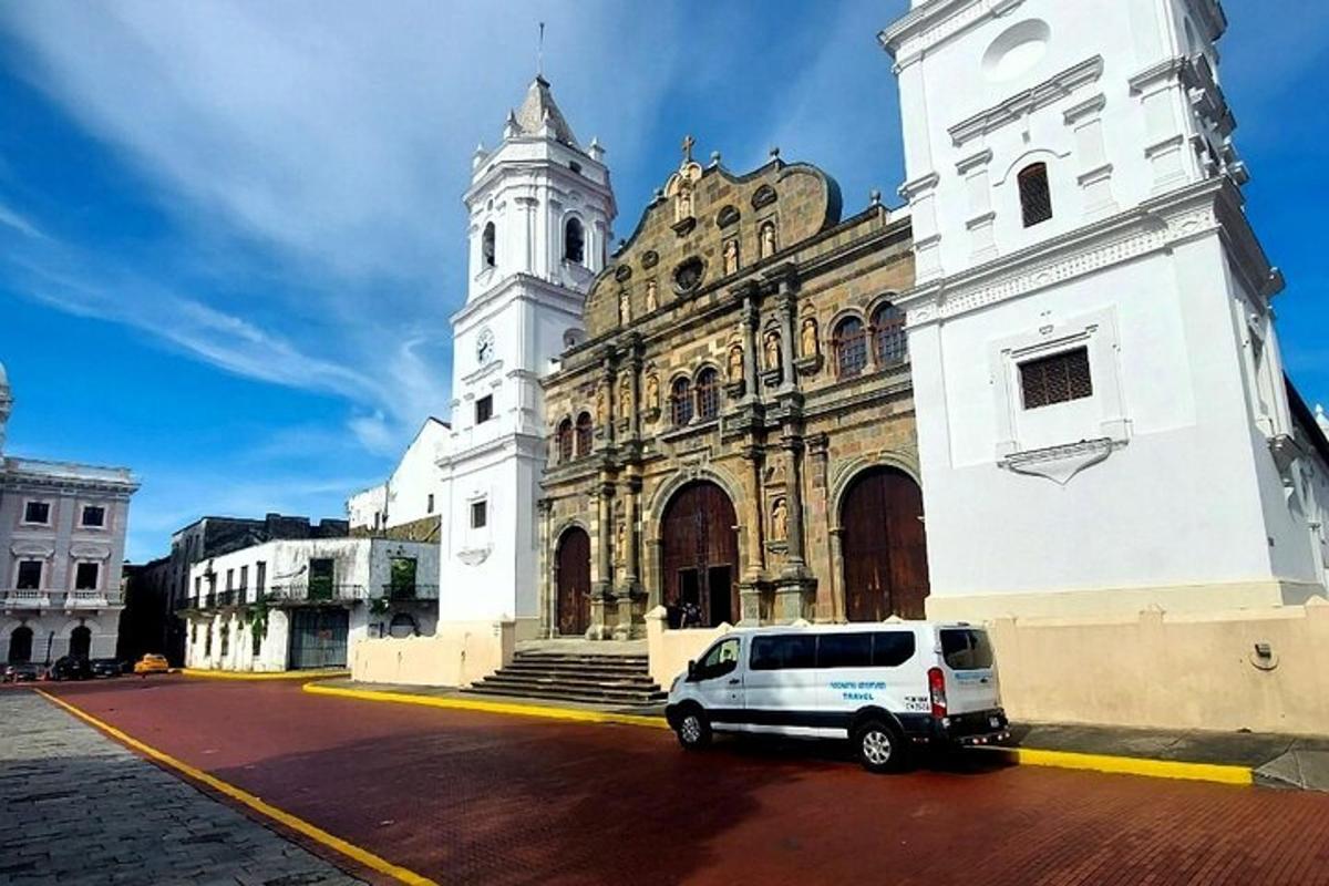 a white van parked in front of a building