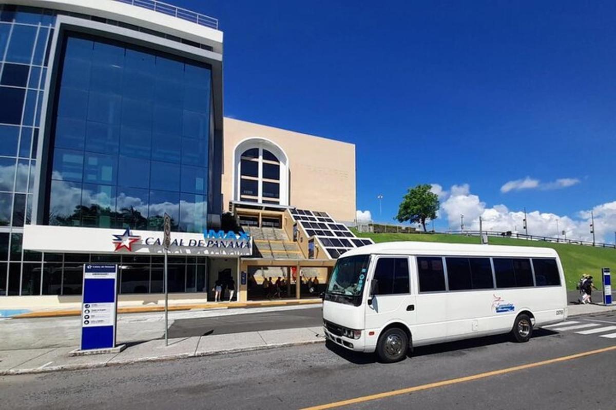 a white van parked in front of a building