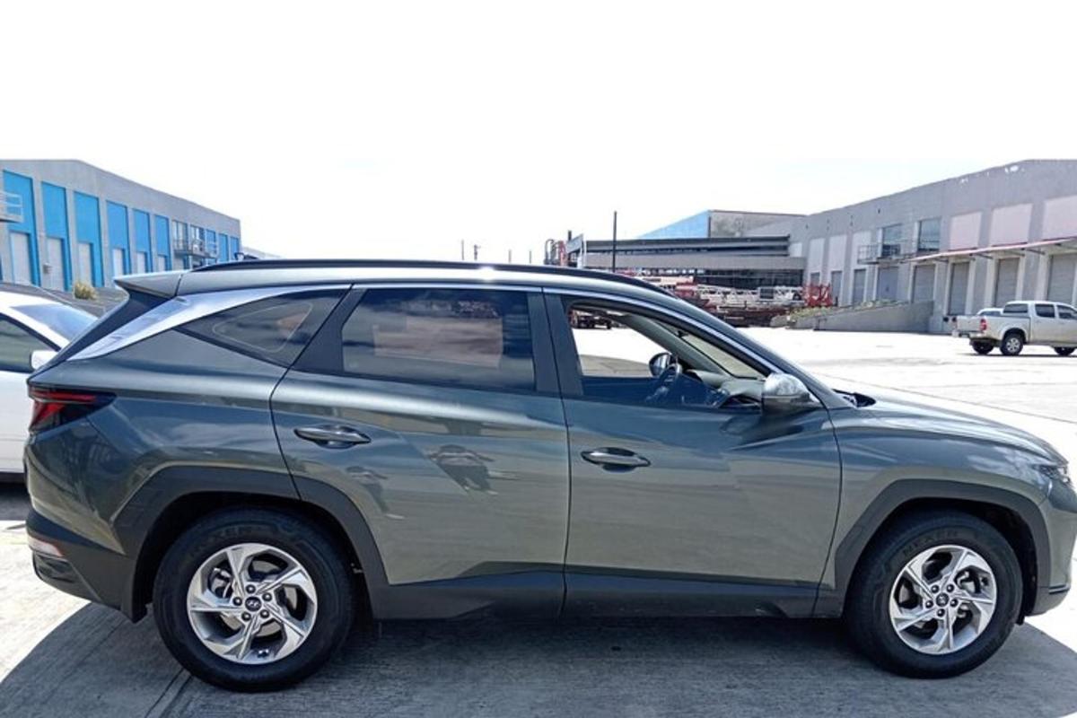 a silver suv parked in a parking lot