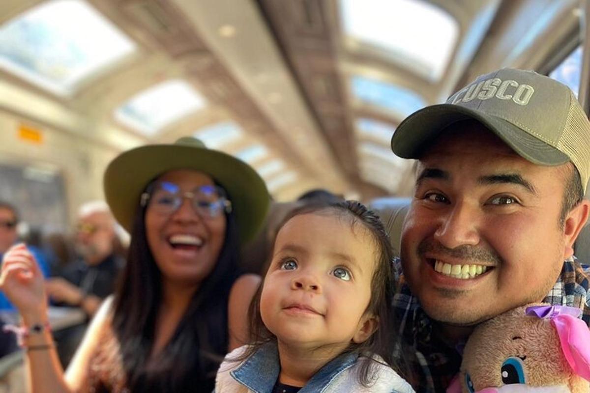 a man and a woman holding a child on a bus