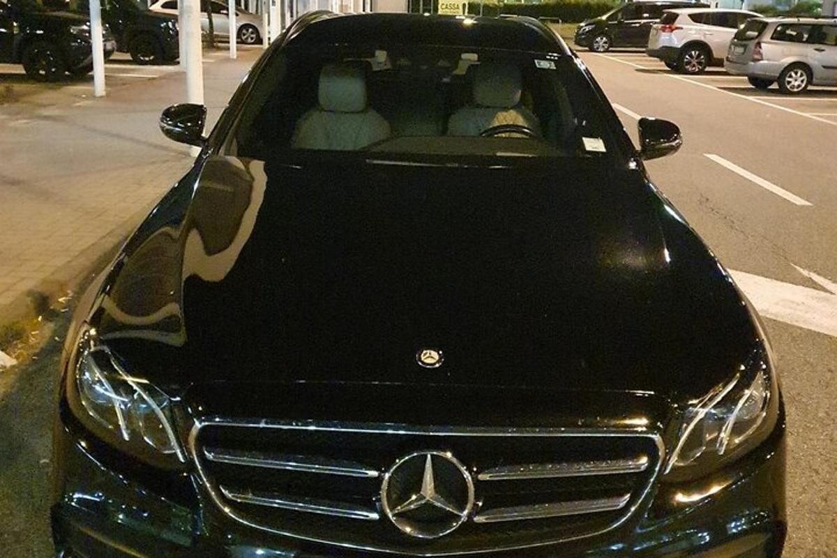 a mercedes benz car parked in a parking lot