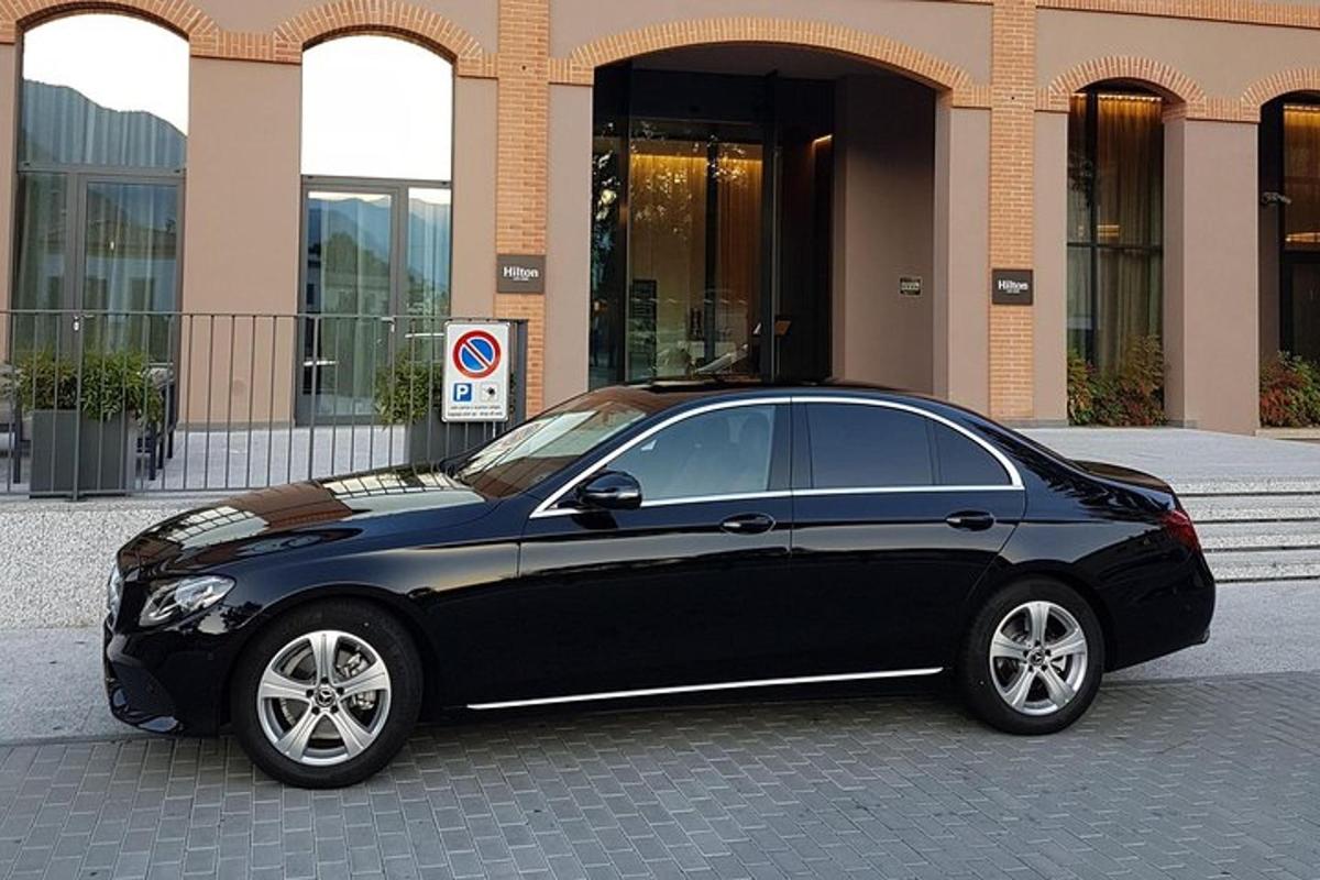 a black car parked in front of a building