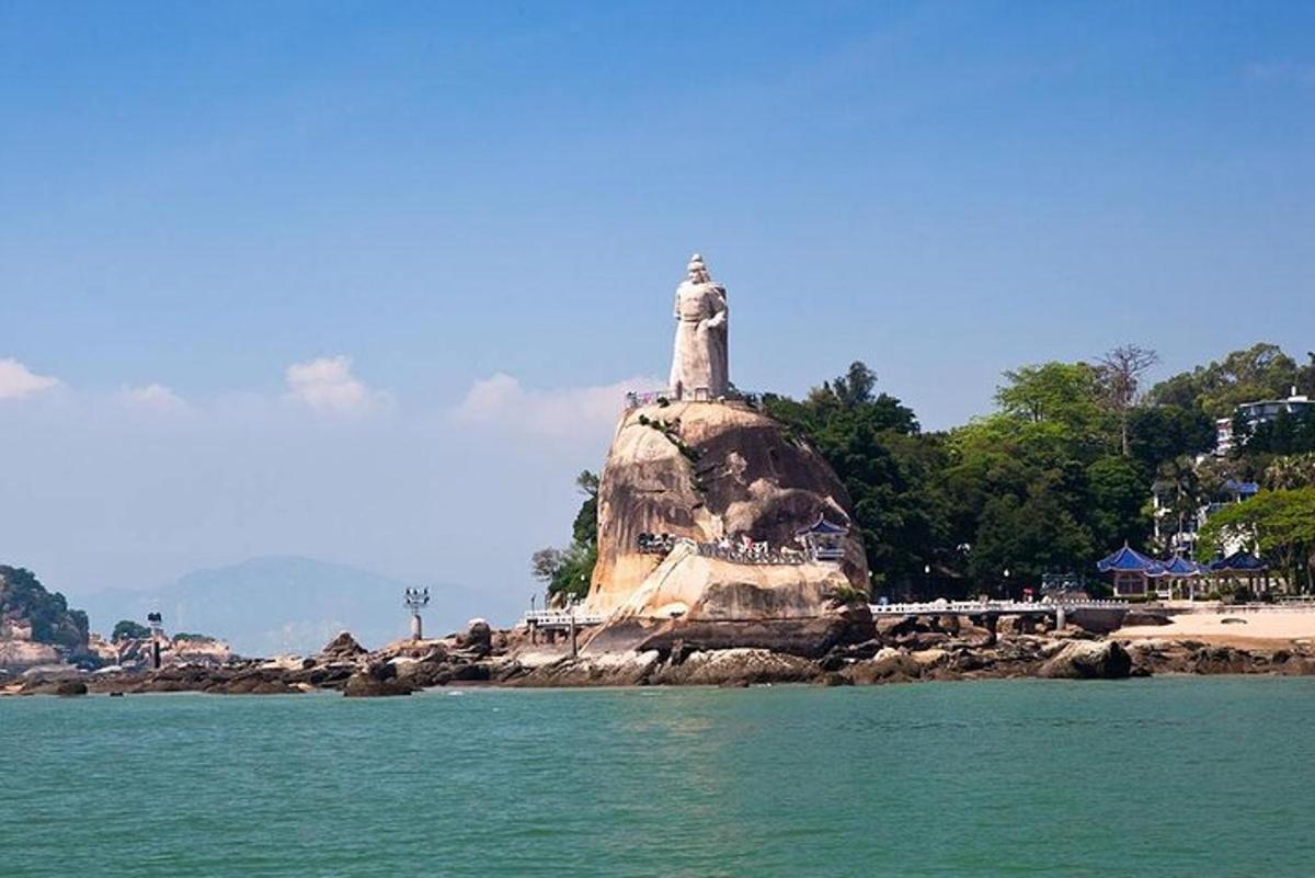 a statue on an island in the water