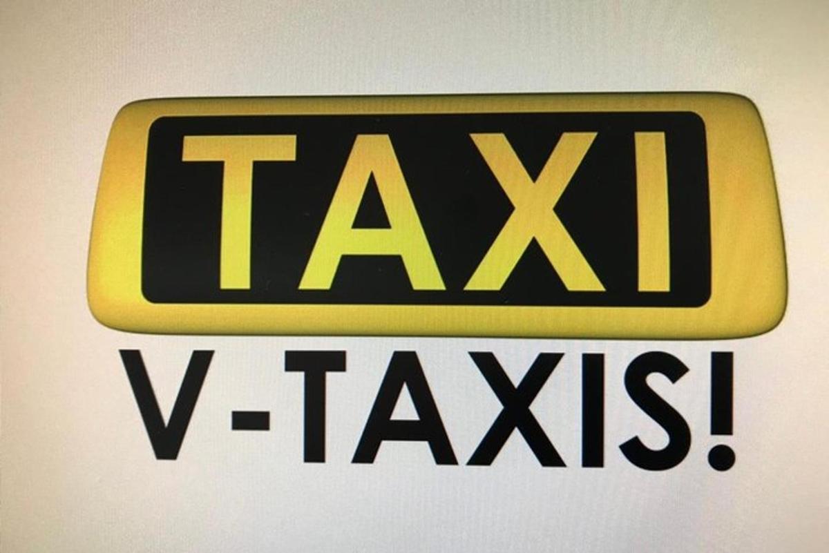 dzeltena un melna zīme uz sienas ar vārdiem "taxix"