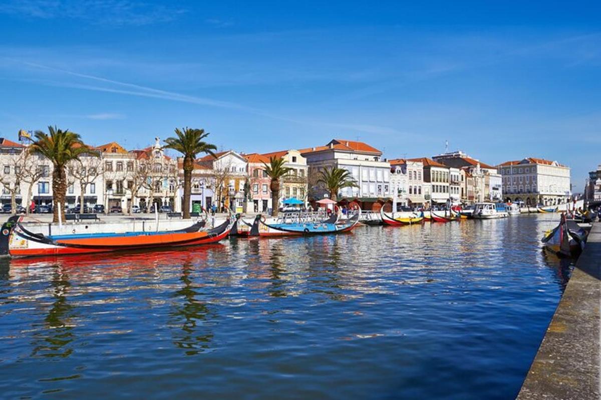 a group of boats docked in a canal with buildings
