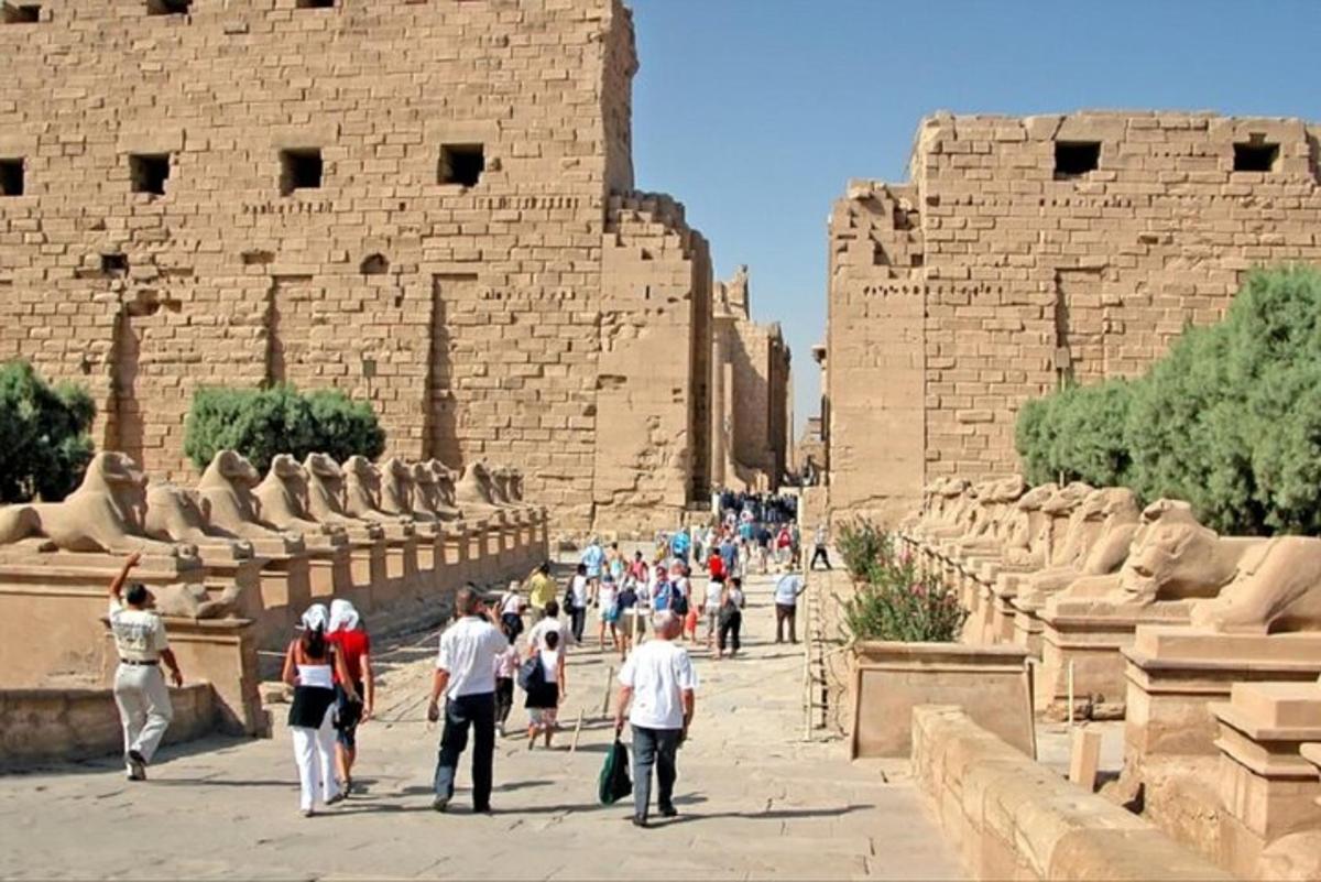 a group of people walking in front of a building