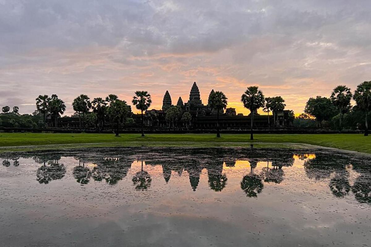 a view of a pond in front of a temple
