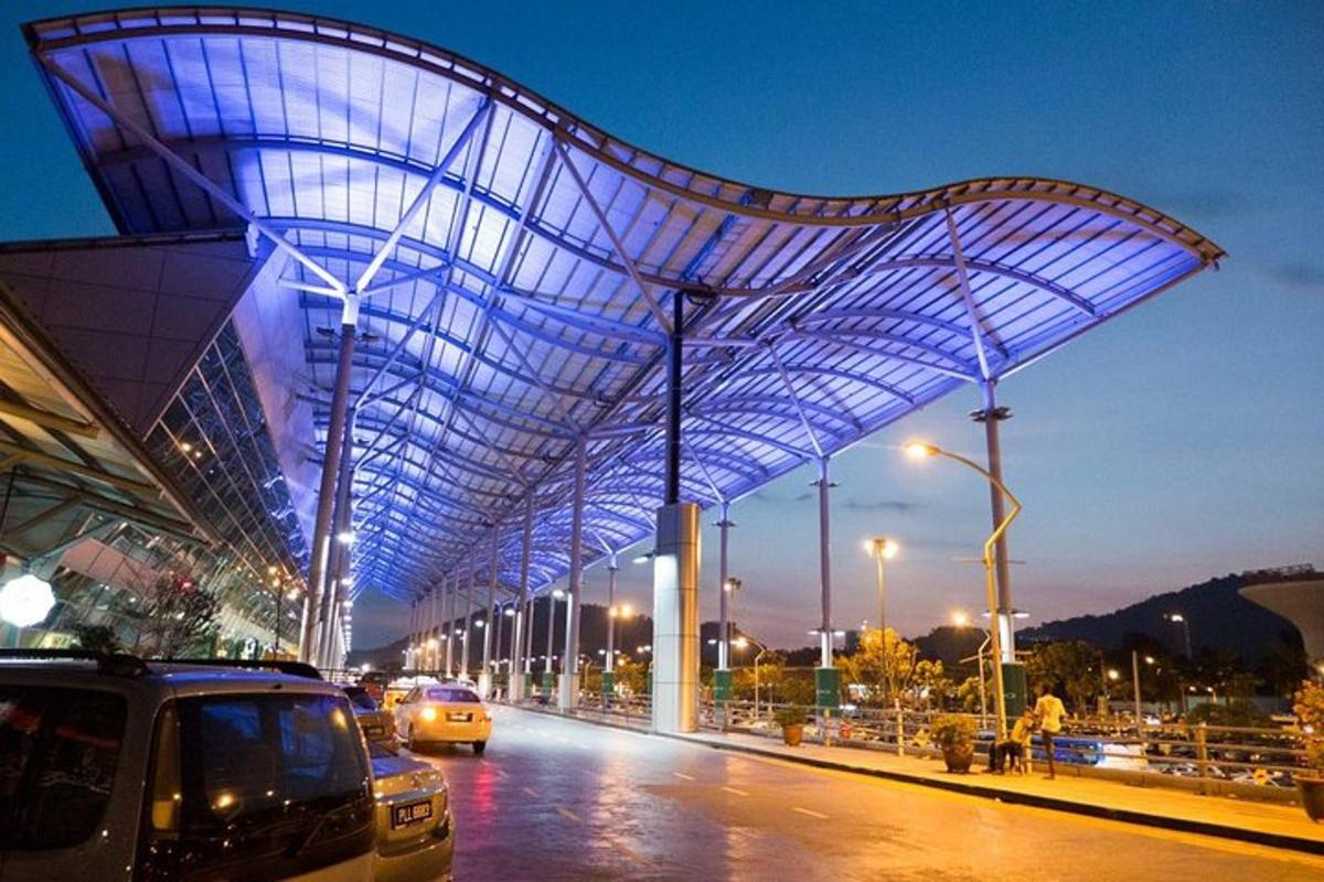 a large building with blue lights on the side of a street