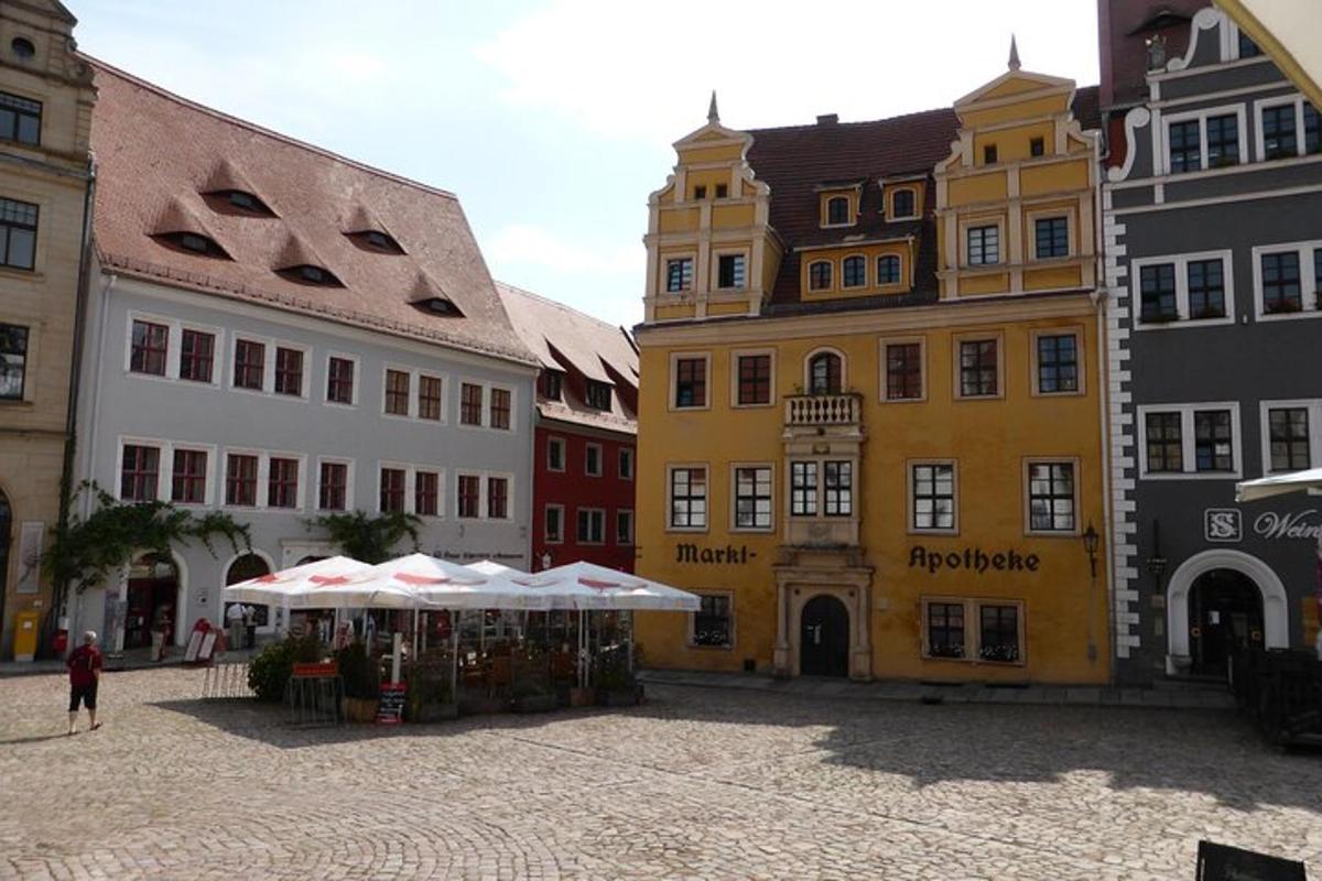 a group of buildings with a market in a street