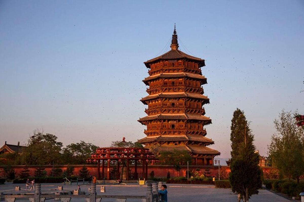 a large building with a tower in a park