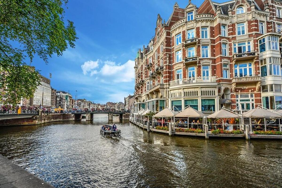 a boat on a river in a city with buildings