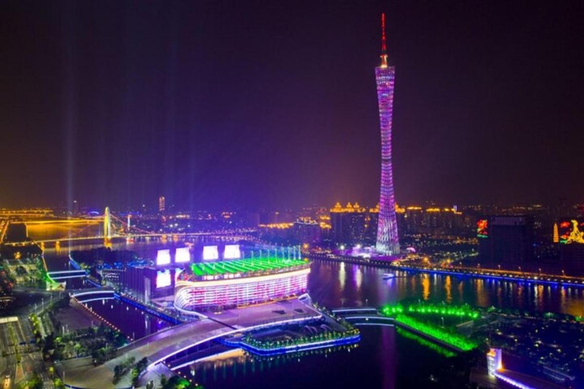 a view of a city with a tower at night