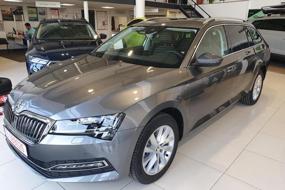 a silver car is parked in a garage