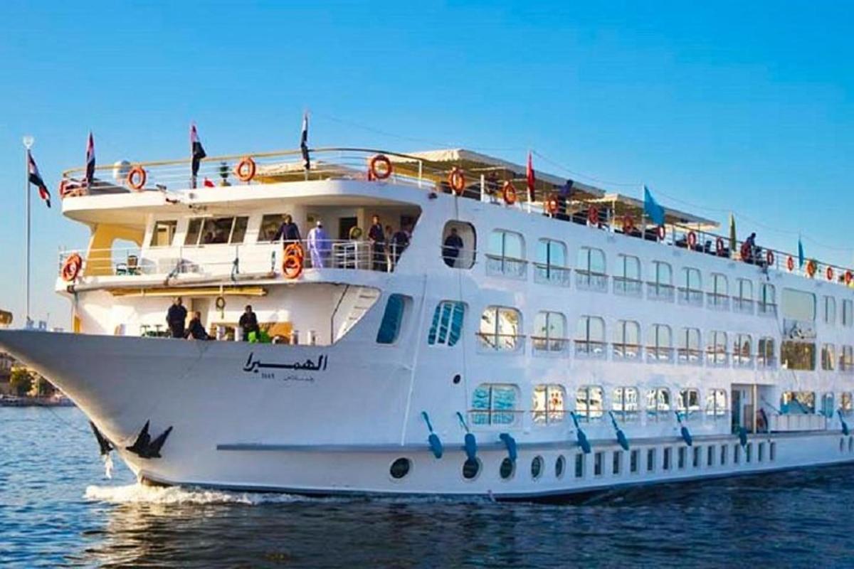 a large white cruise ship in the water