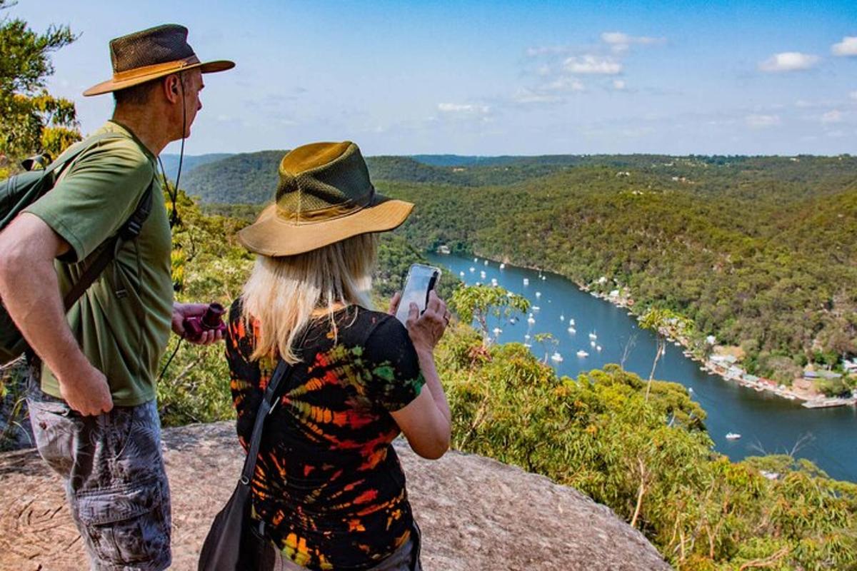a man and a woman taking a picture of a river