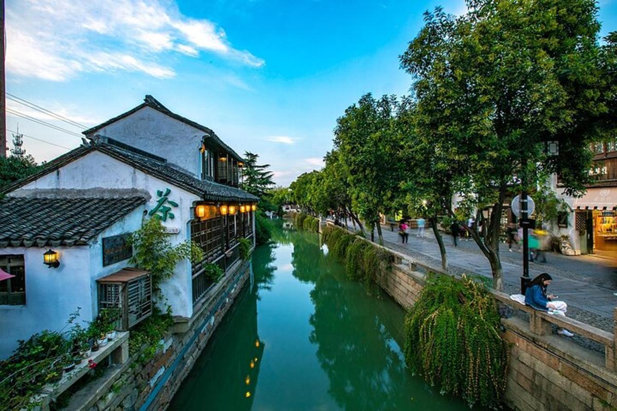 a river with a building next to a canal