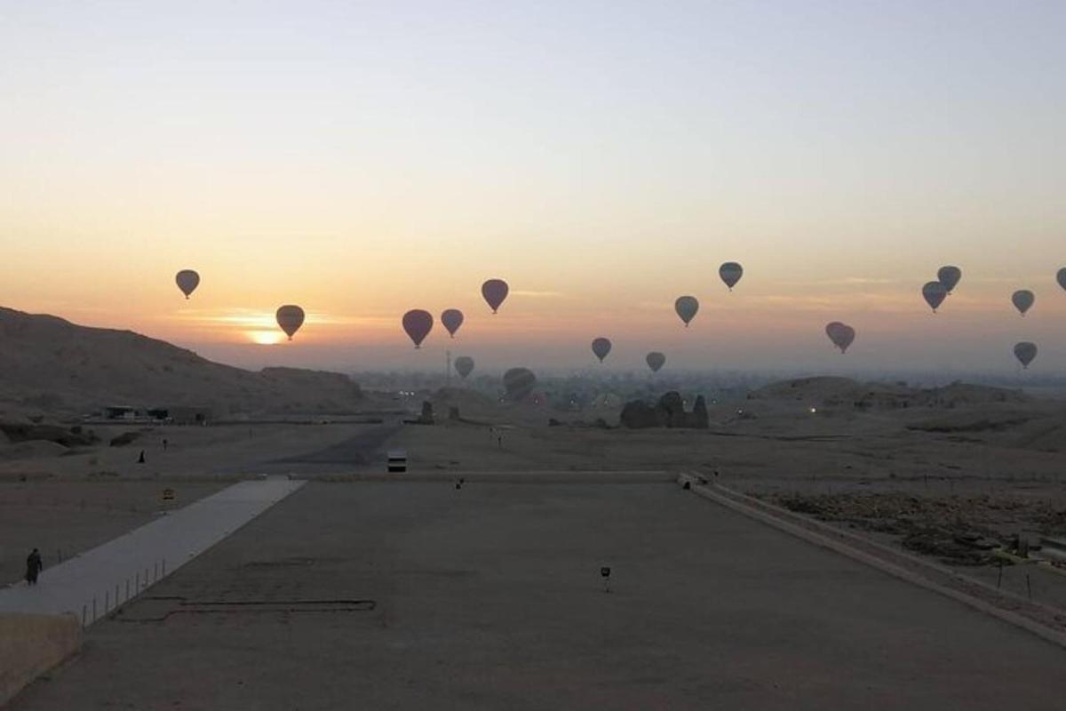 a group of hot air balloons flying in the sky