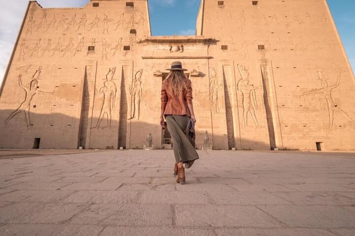 a woman walking in front of a building