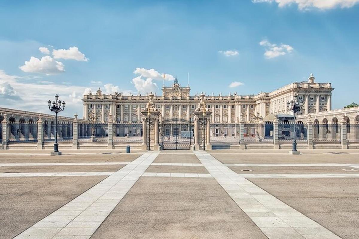 a large white building with columns in a courtyard