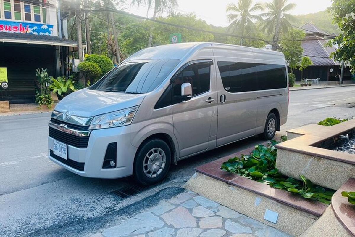a silver van parked on the side of a street