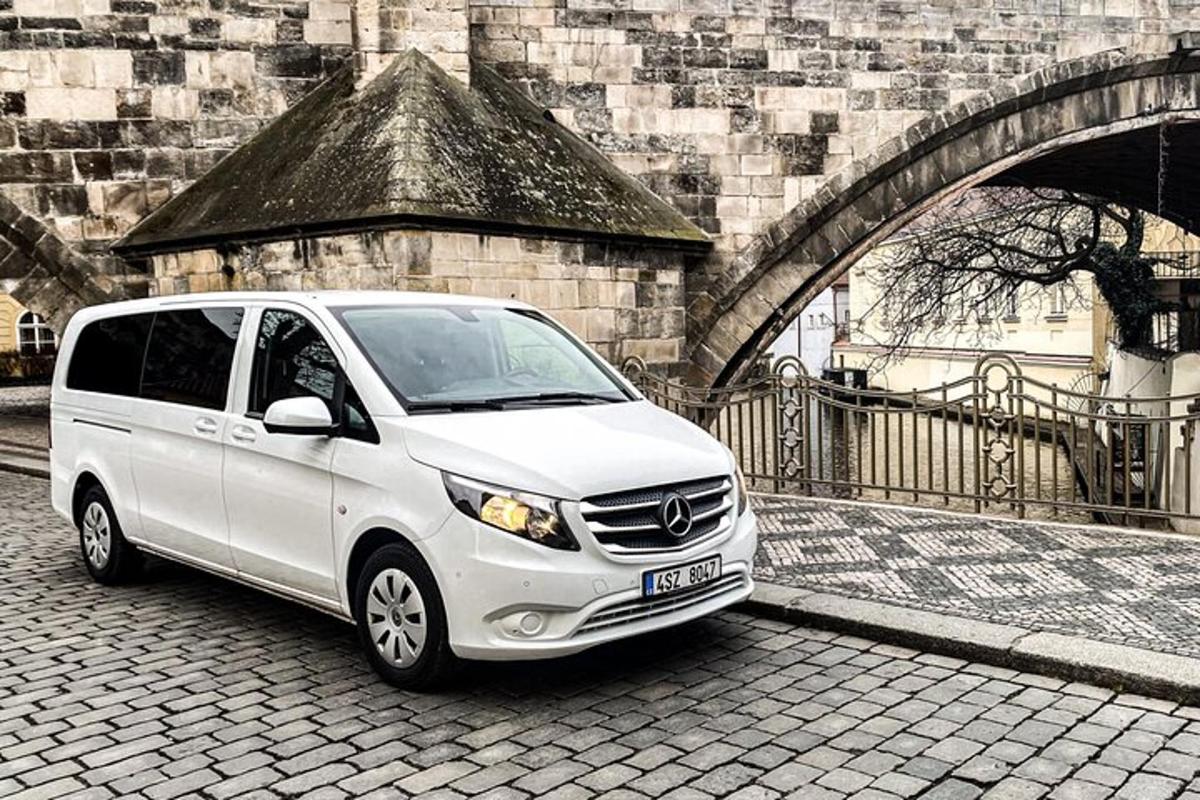a white van parked in front of a building