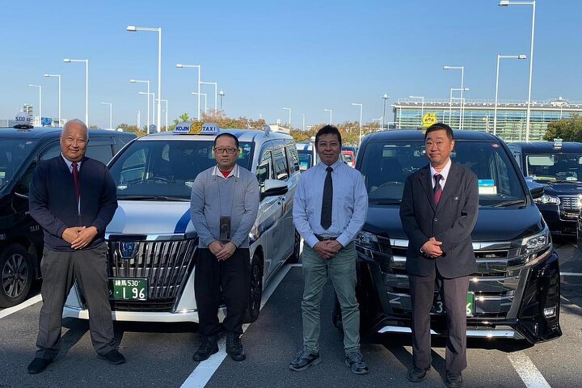 a group of men standing in front of a parking lot