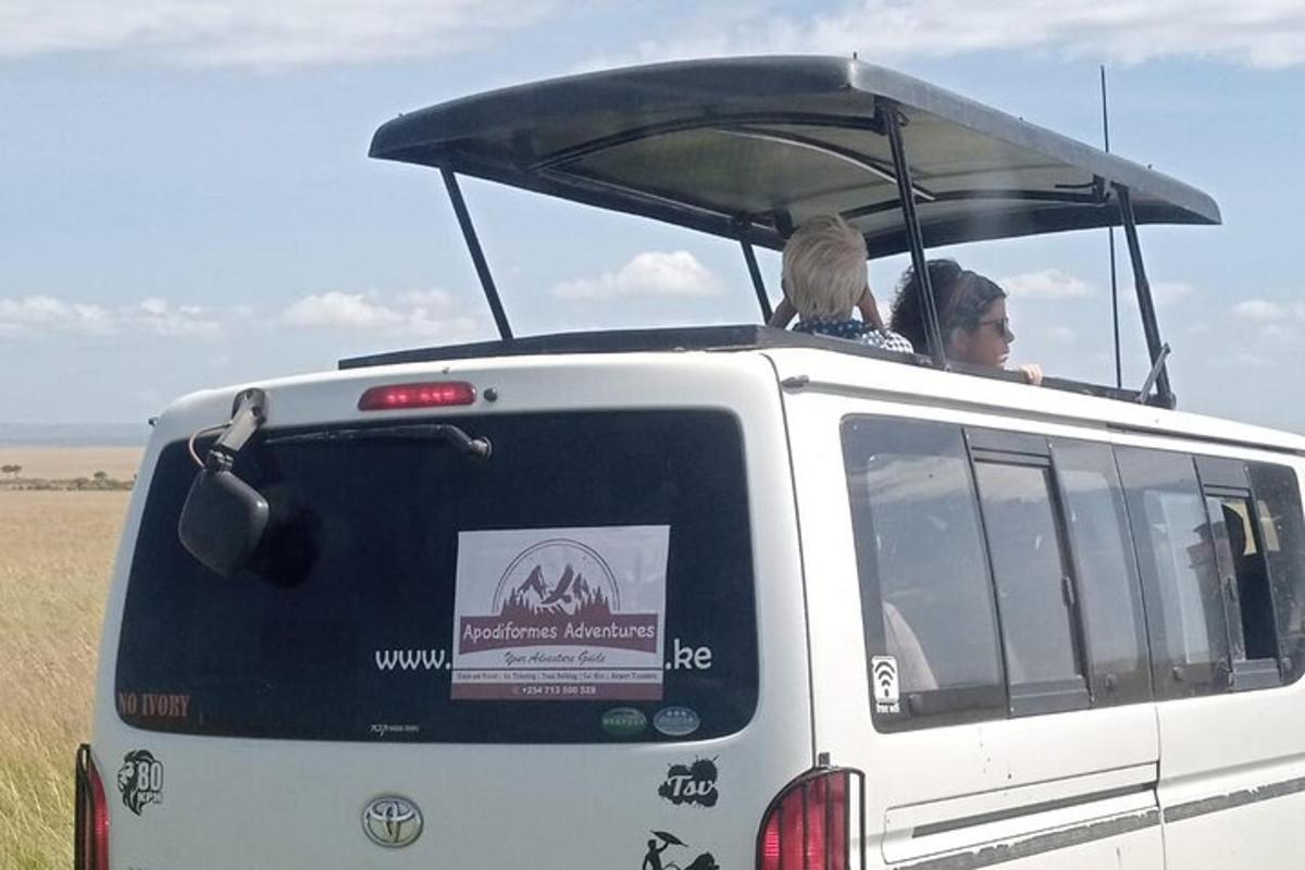 a woman and a child sitting in the back of a van