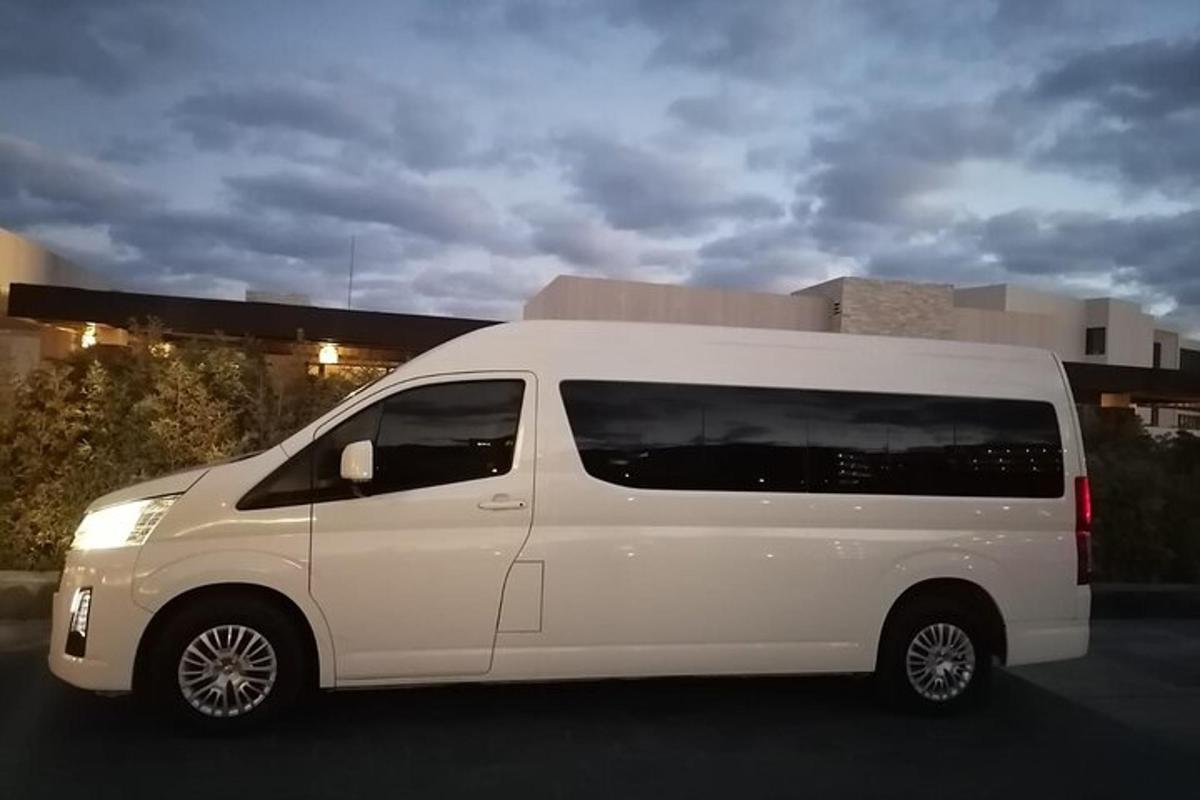 a white van parked in front of a building