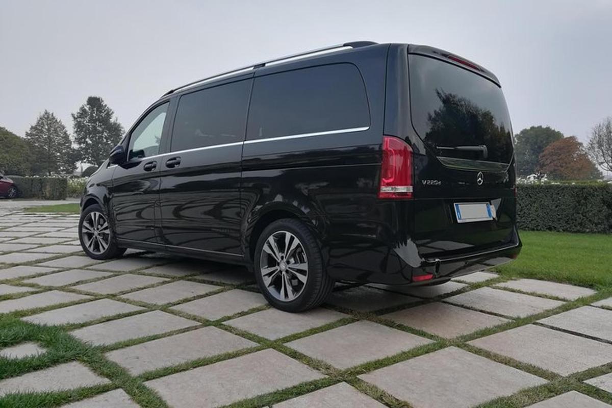 a black van is parked in a driveway