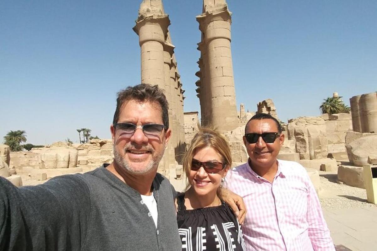 a group of people standing in front of a mosque