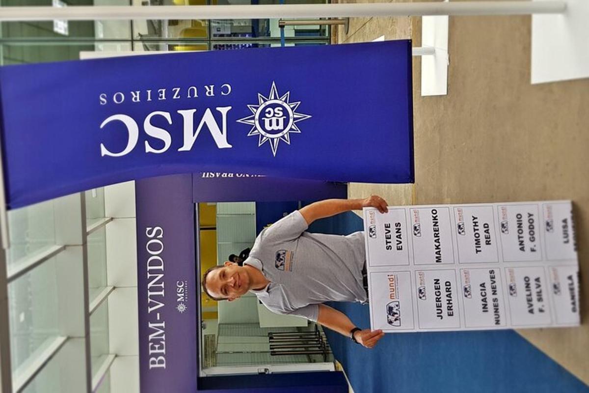 a man is standing under a sign in a building