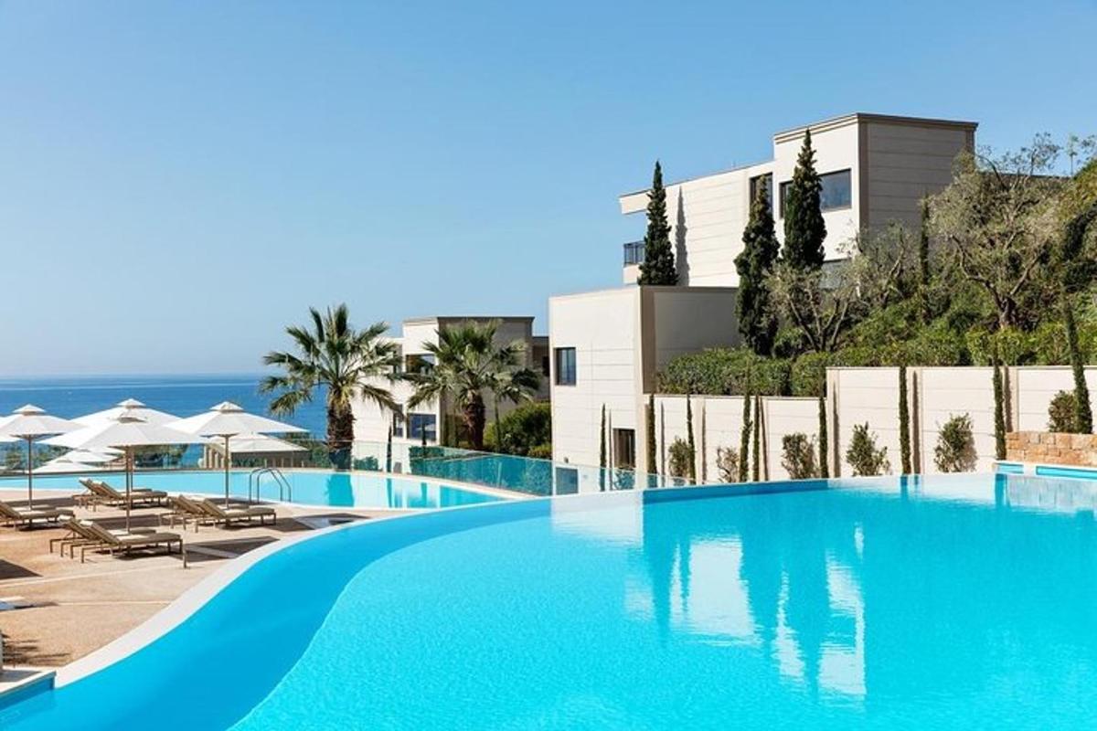 a large blue swimming pool next to a building