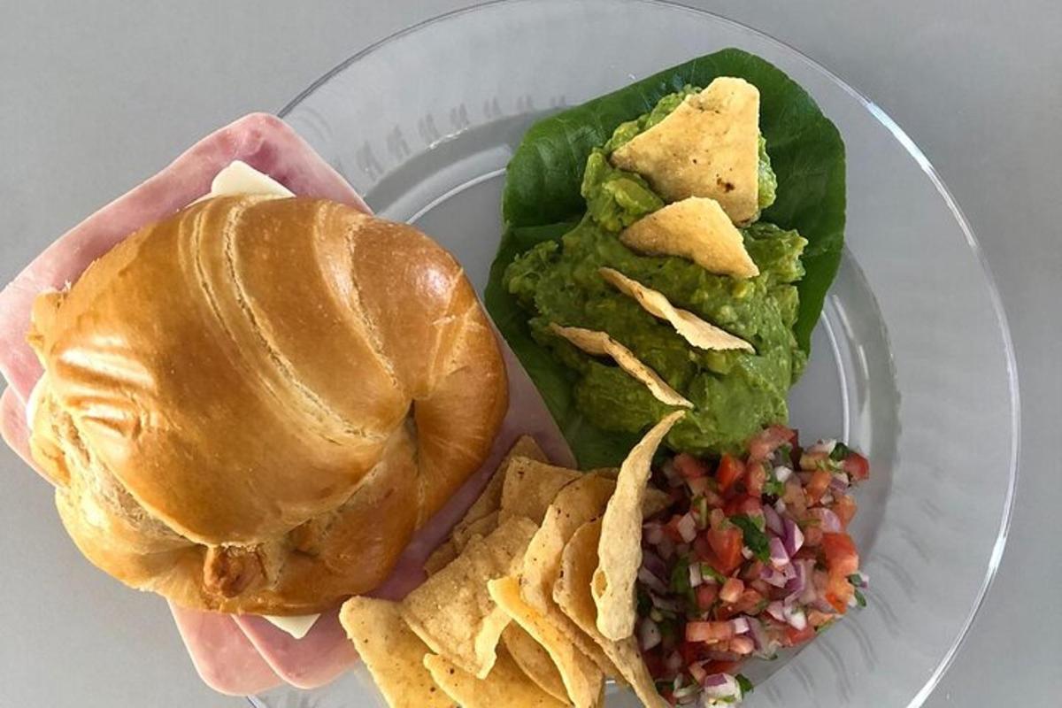 a plate of food with a sandwich and chips
