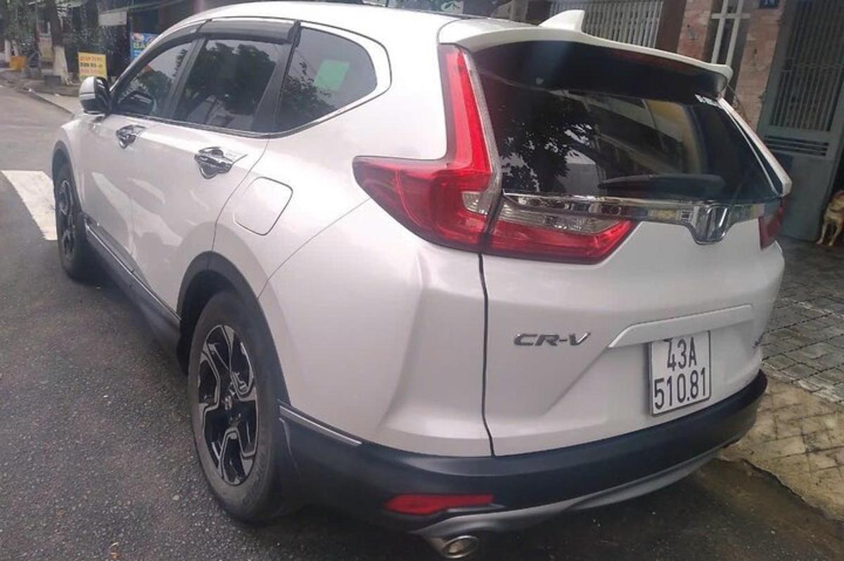 a white car parked on the side of a street