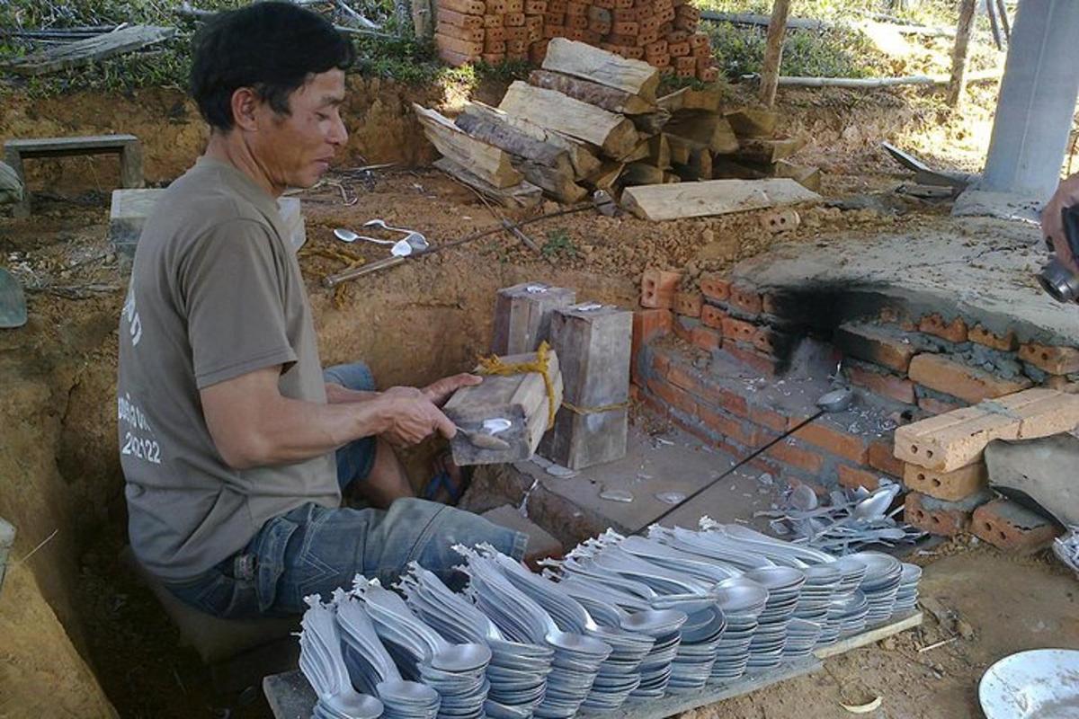 a man is making pottery in a brick oven