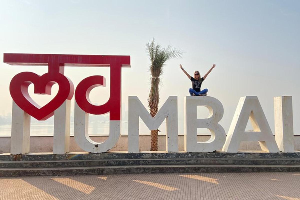 a woman is standing on top of a sign