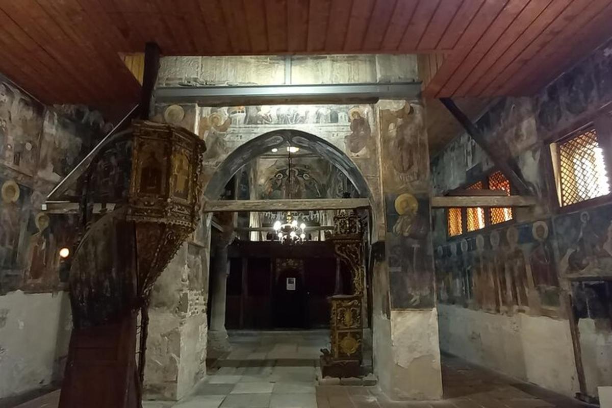 an entrance to a building with paintings on the walls