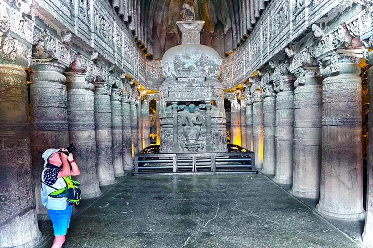 a woman taking a picture of a large building