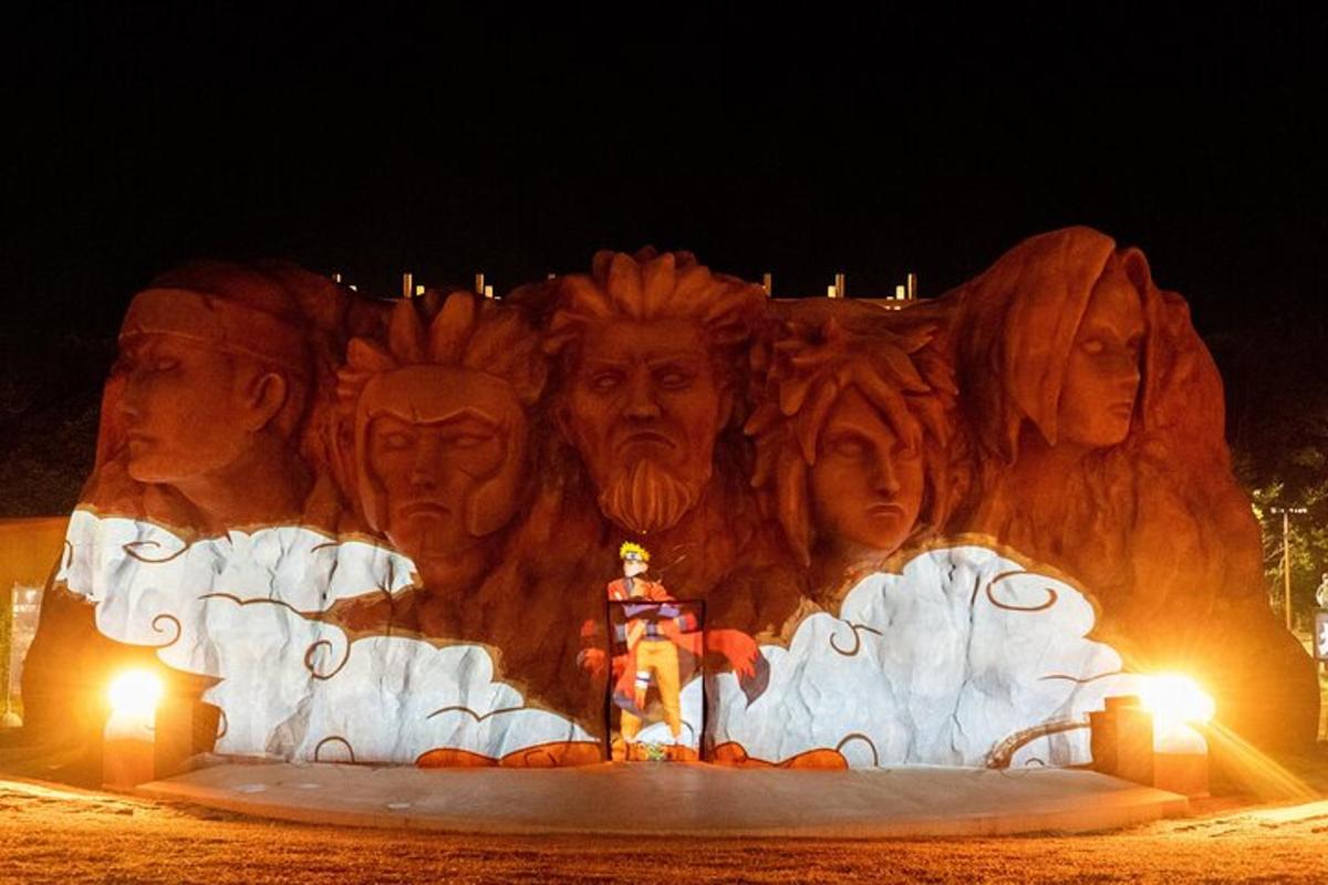 a large statue of a group of people with lights