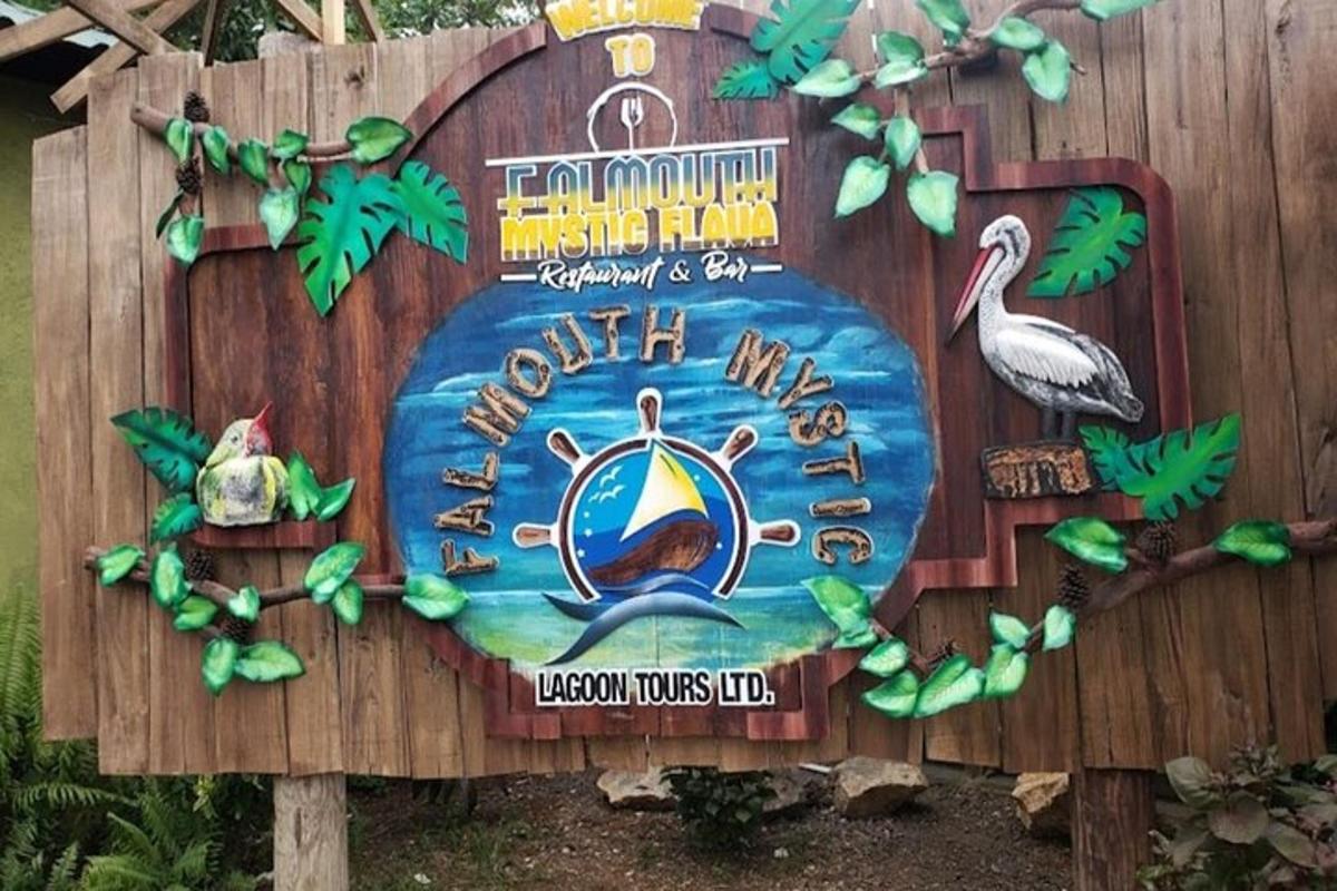 a sign for the ocean mouse club on a wooden fence