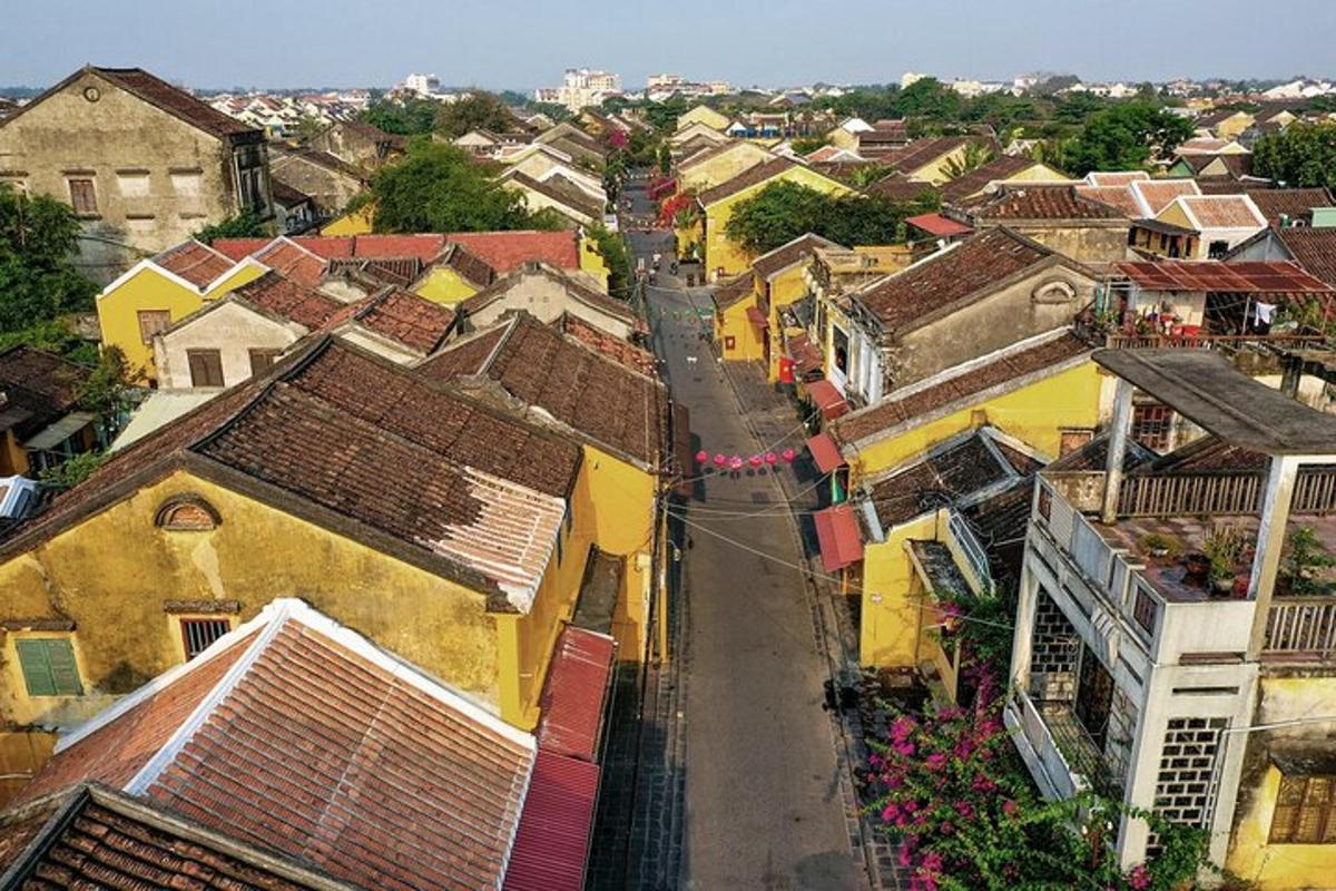an aerial view of a town with yellow buildings