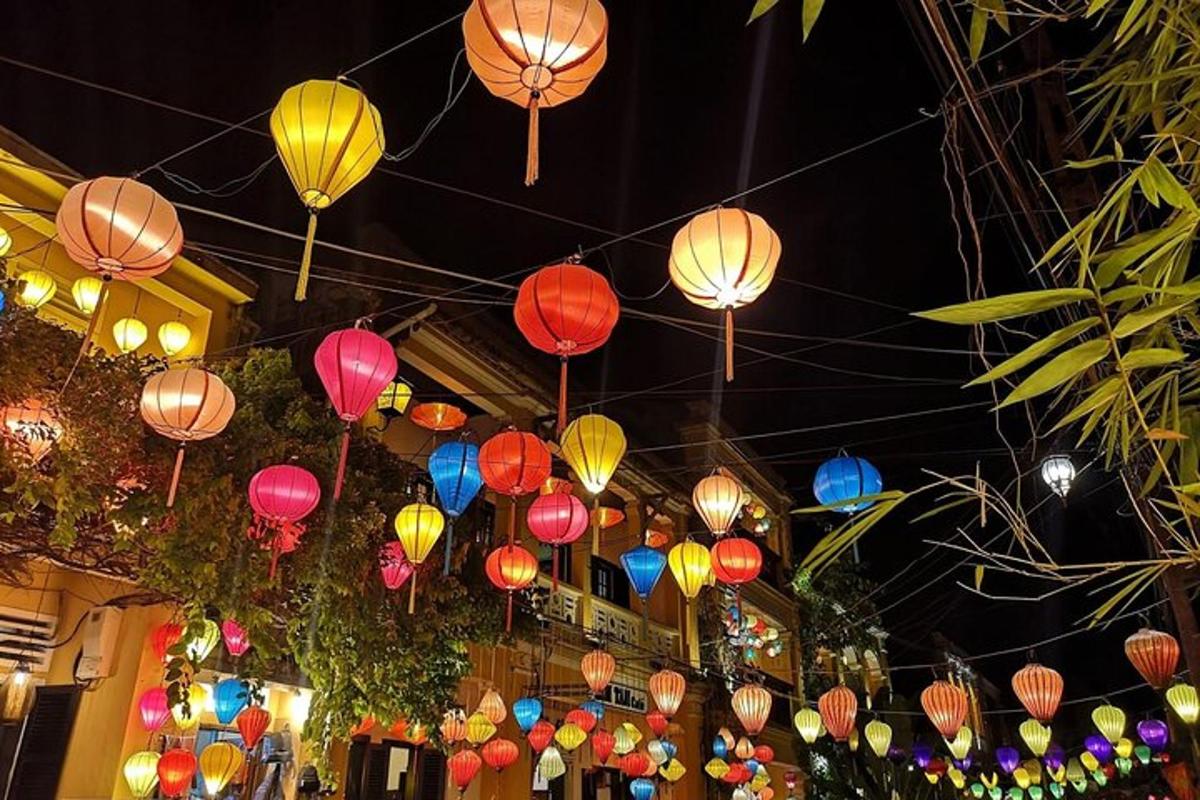 a bunch of colorful lanterns hanging from a building