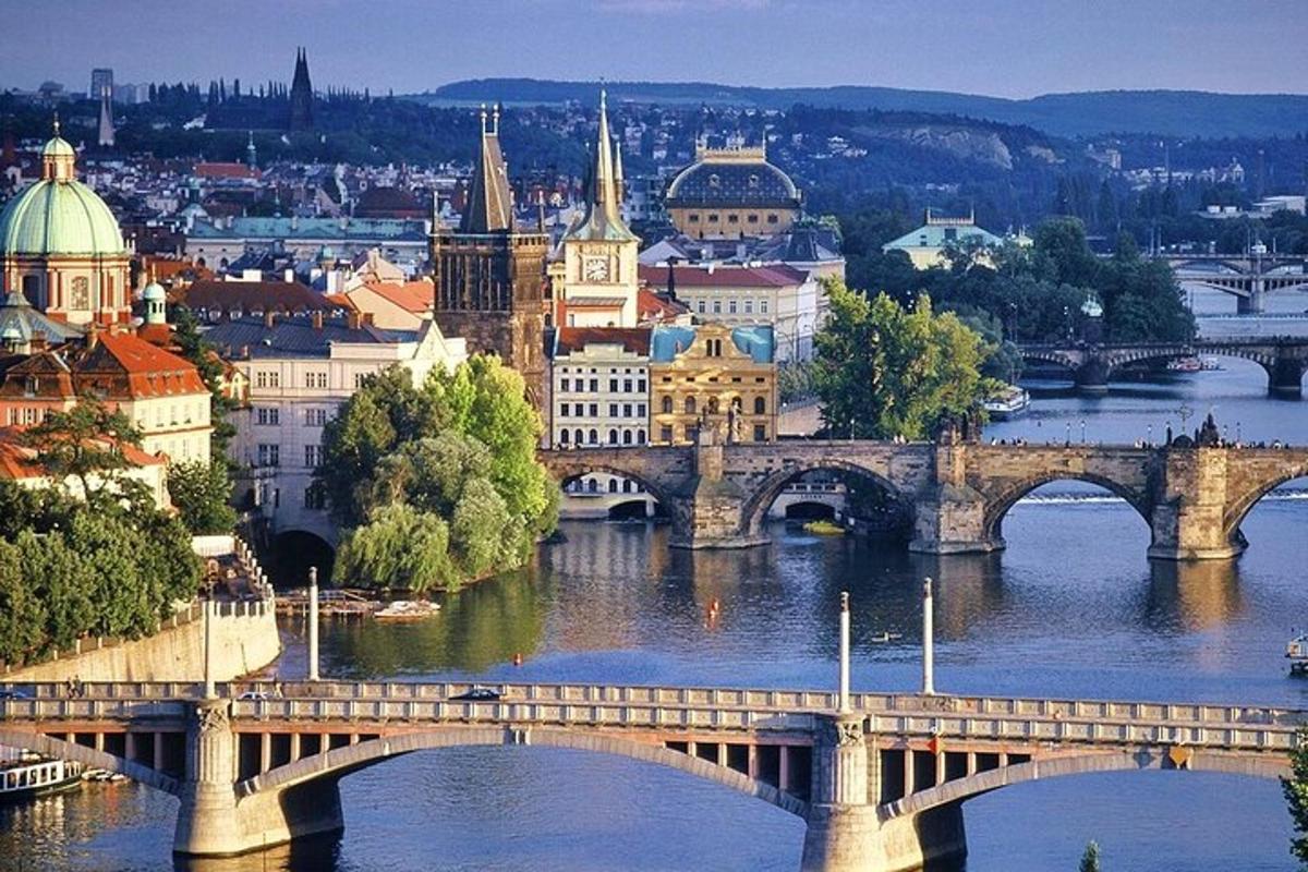 a city with a bridge over a river with buildings