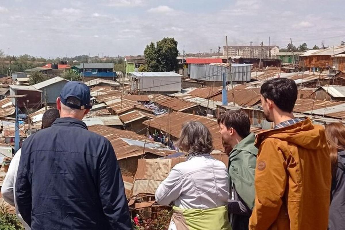 a group of people standing around in a village