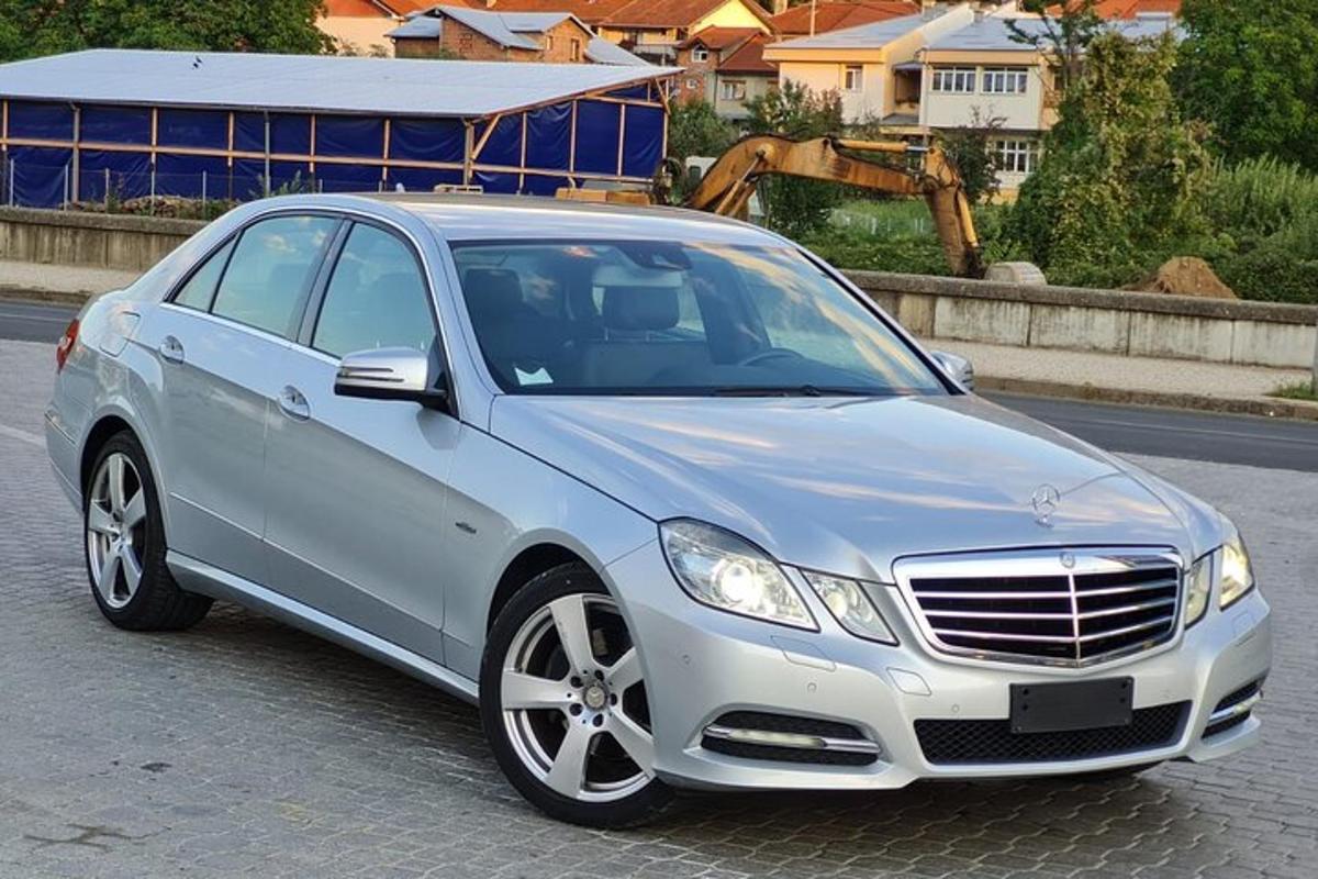 a silver car parked on the side of the road
