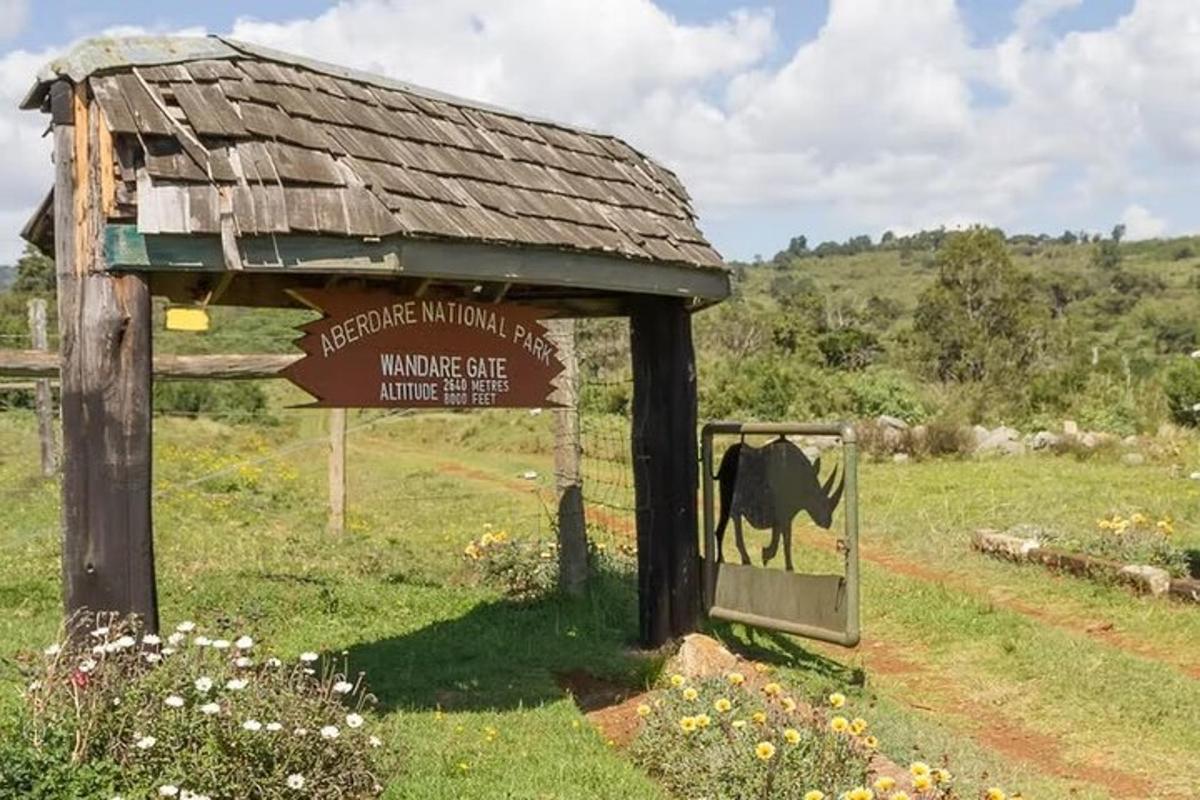 a sign with a cow standing in a field