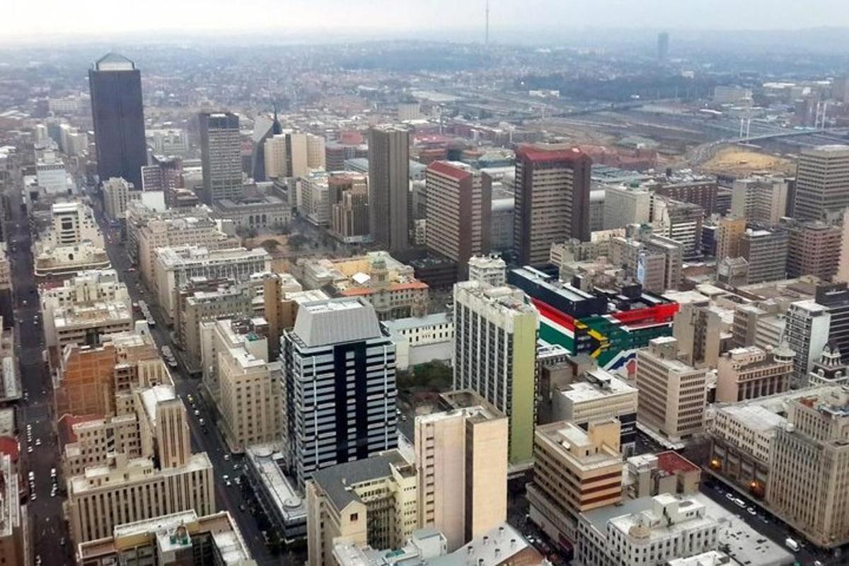 an aerial view of a city with tall buildings