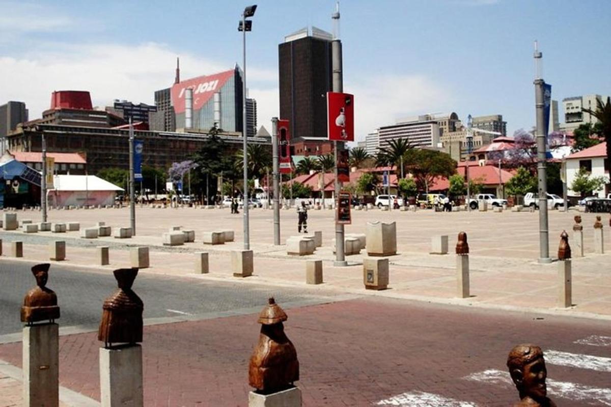 a city street with a large plaza with buildings