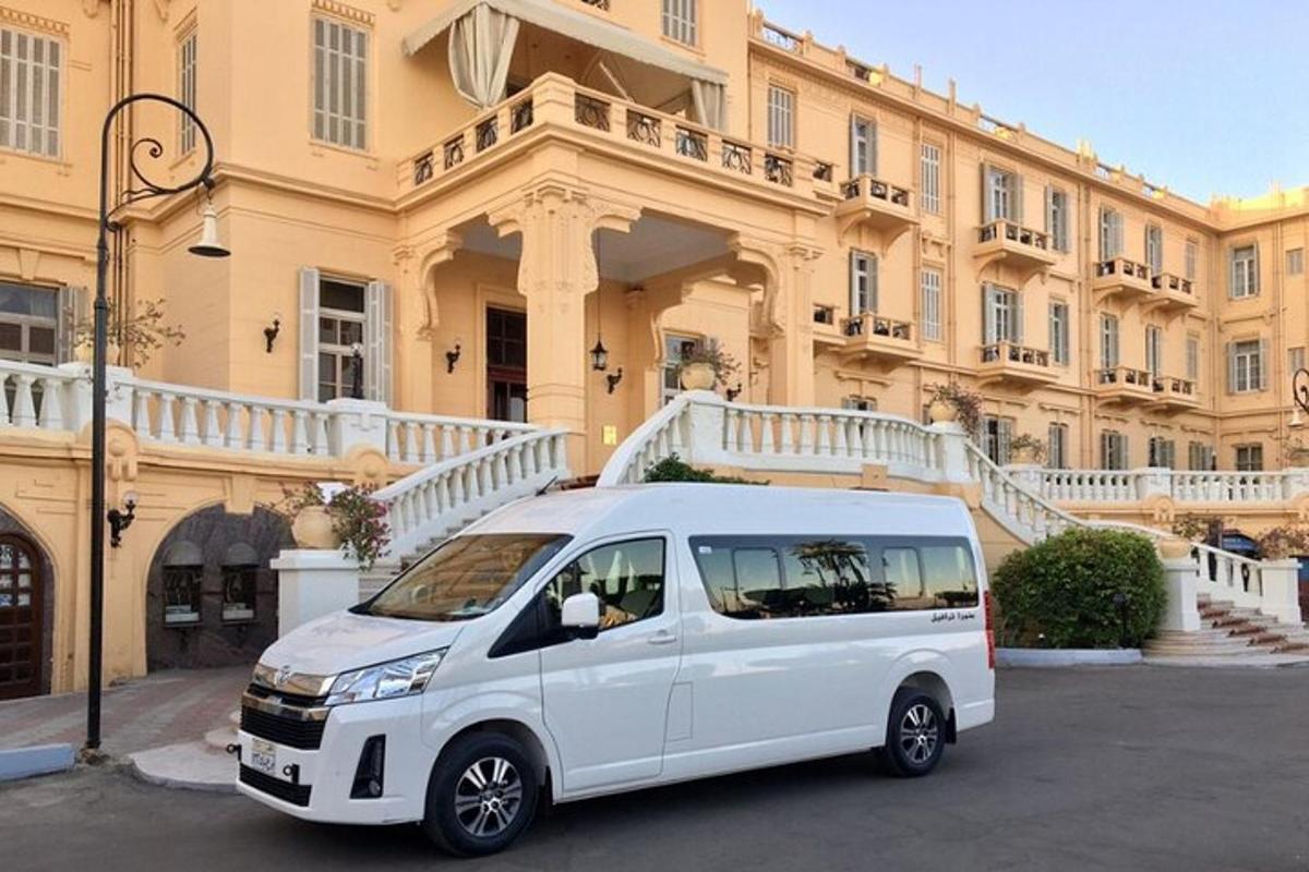 a white van parked in front of a building